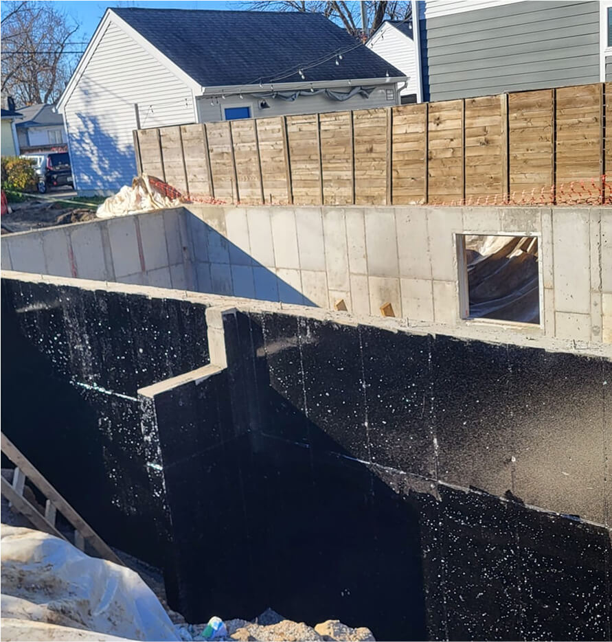 New Build basement foundation with waterproofing on the outside.
